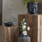 Unique handcrafted wooden pedestals designed to add warmth and character to modern spaces. 