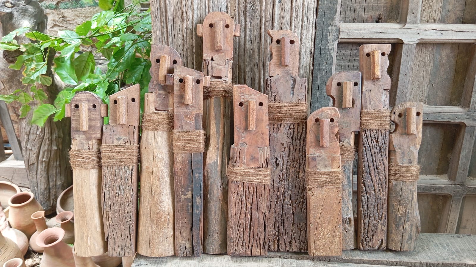 Ekaurr United Friends Reclaimed Wood Wall Decor additional angle highlighting the craftsmanship and texture of the piece, in brown