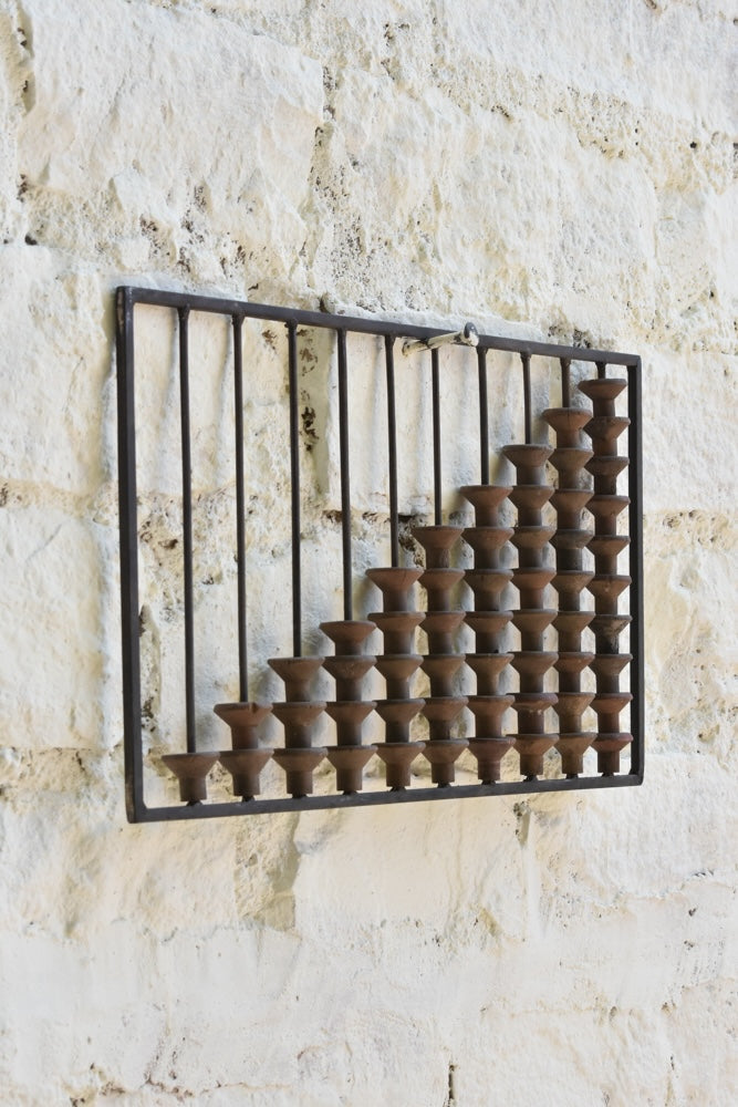 Close-up of Ekaurr Abacus Wall Art showing worn wooden spool textures and metal frame detail – artisanal nostalgic decor