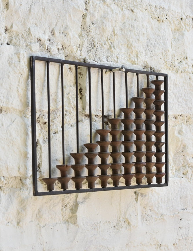 Close-up of Ekaurr Abacus Wall Art showing worn wooden spool textures and metal frame detail – artisanal nostalgic decor