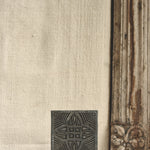 Ekaurr Artistry Print Block on Marble Base Décor, vintage hand-carved Indian textile printing block repurposed as table décor on a marble base, artisan heritage display piece