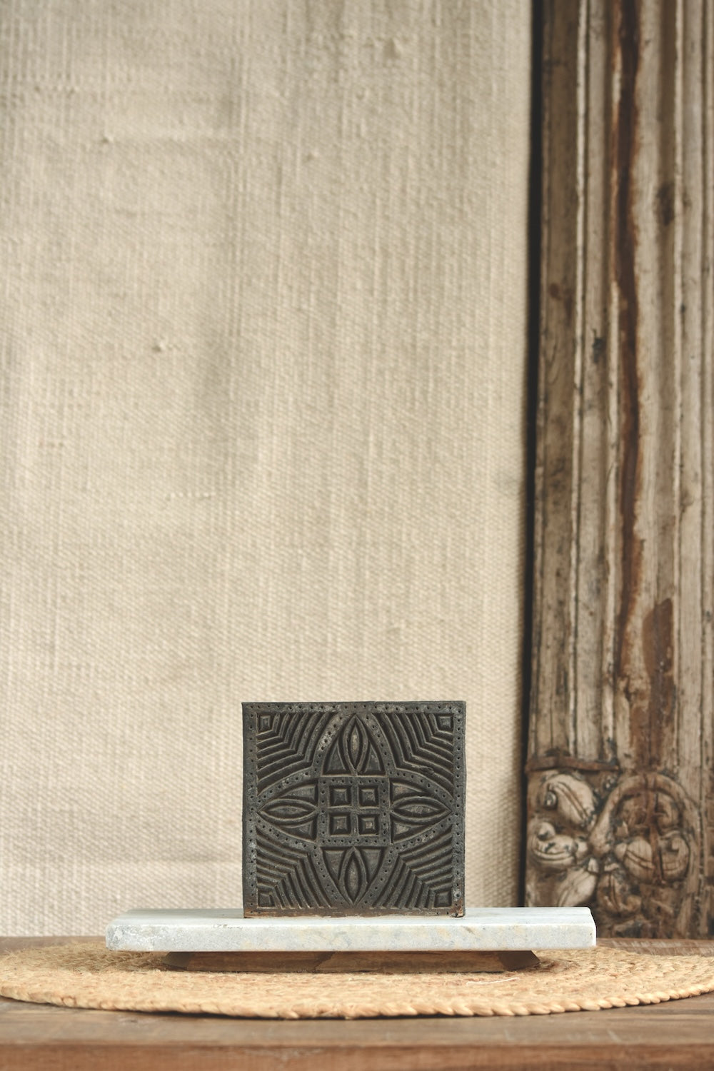 Ekaurr Artistry Print Block on Marble Base Décor, vintage hand-carved Indian textile printing block repurposed as table décor on a marble base, artisan heritage display piece