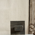 Ekaurr Artistry Print Block on Marble Base styled in a home décor vignette, showing hand-carved woodwork patina and natural imperfections with marble contrast base