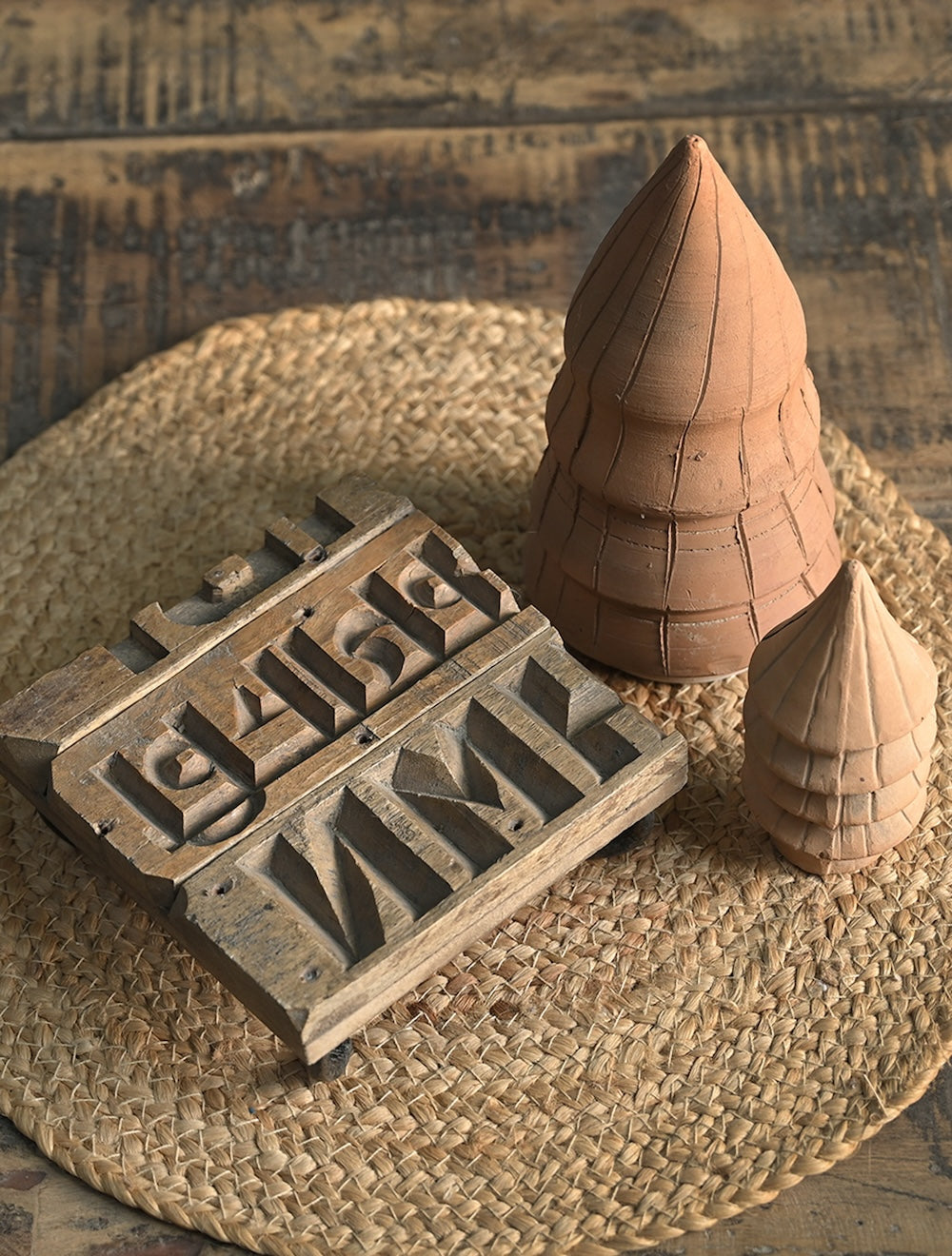 Ekaurr Brick Mold Emblem Riser vintage clay brick mould repurposed as a decorative display riser with emblem detailing, found object artisan pedestal for sculptures candles and home accents