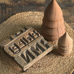 Ekaurr Brick Mold Emblem Riser vintage clay brick mould repurposed as a decorative display riser with emblem detailing, found object artisan pedestal for sculptures candles and home accents