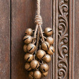 Ekaurr Bunch of 30 Brass Bells Wall Hanging cluster of vintage brass ghungroo bells tied together as a melodic wall hanging, auspicious artisan home decor for entryways altars and festive Indian-inspired home styling