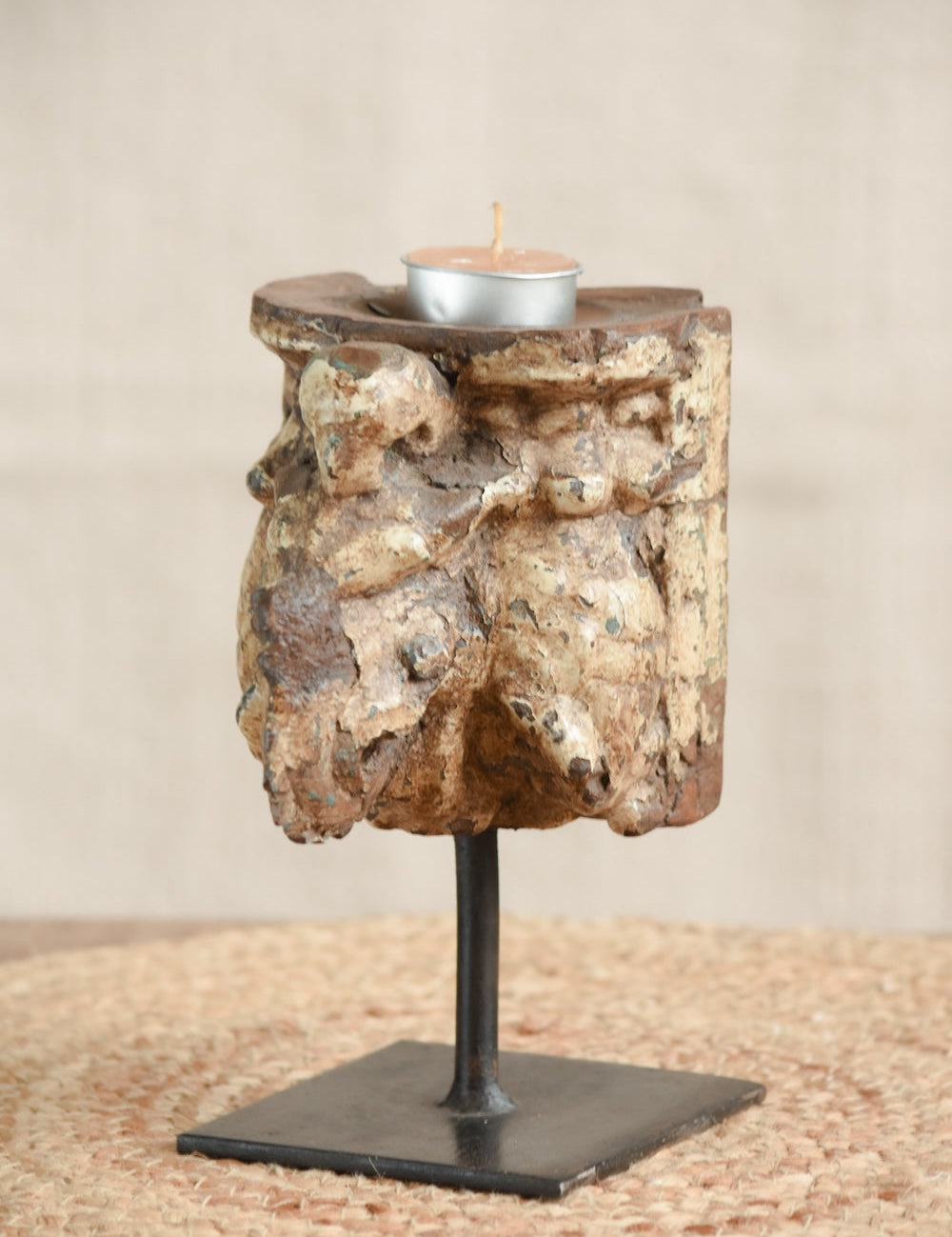 Ekaurr Carved Candle Stand in Distressed Finish with vintage hand-carved wood on iron base, earthy rustic candle holder celebrating aged craftsmanship and natural patina