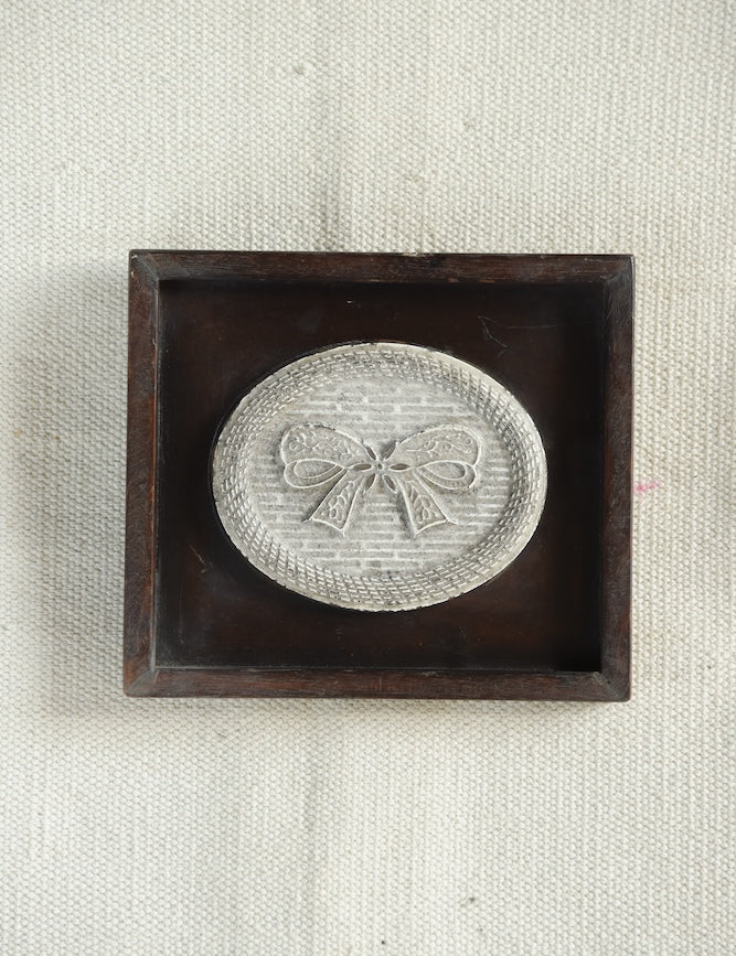 Ekaurr Ceramic Tile Wall Art – The Lace Bow Emblem, handcrafted embossed ceramic tile with classical bow motif in deep wooden shadow box, vintage home wall accent