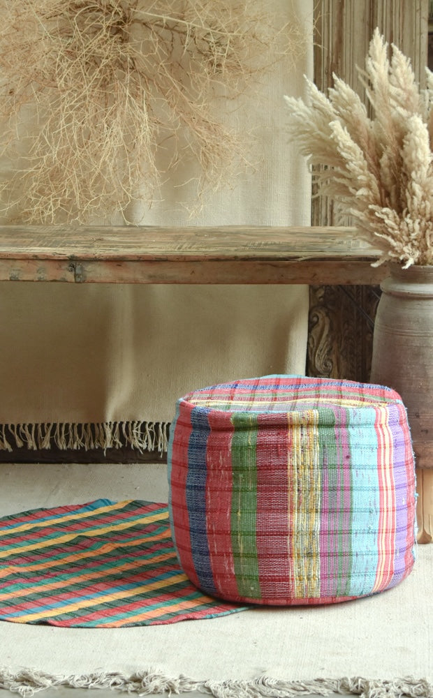 Ekaurr Chindi Pouffe and Rug Set handwoven from upcycled fabric scraps with bold colourful stripes, sustainable artisan home decor set