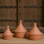 Ekaurr Classic Tagine Serving Dish set of 3 handmade natural clay tagine-form serving dishes with conical lid shape crafted by rural Indian artisans, earthy artisan kitchen essentials for slow-cooked dishes and globally inspired conscious dining