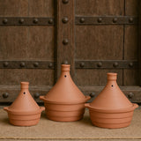 Ekaurr Classic Tagine Serving Dish set of 3 handmade natural clay tagine-form serving dishes with conical lid shape crafted by rural Indian artisans, earthy artisan kitchen essentials for slow-cooked dishes and globally inspired conscious dining