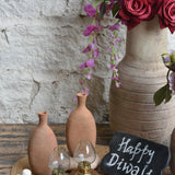 Ekaurr Clay Flame Gift Set curated artisan gift set of handmade terracotta or clay tea light holders by rural Indian artisans with complimentary greeting card, earthy sustainable gifting celebrating Indian clay craft for home ambience and conscious gifting
