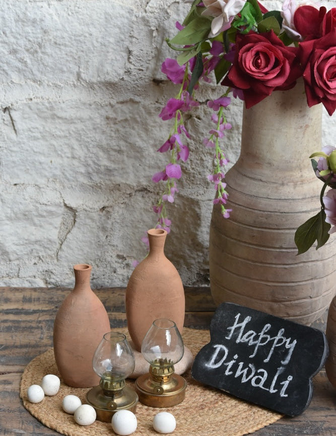 Ekaurr Clay Flame Gift Set curated artisan gift set of handmade terracotta or clay tea light holders by rural Indian artisans with complimentary greeting card, earthy sustainable gifting celebrating Indian clay craft for home ambience and conscious gifting