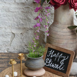 Ekaurr Clay Gold Glow Gift Set curated artisan gift set of handmade clay or terracotta pieces paired with gold-toned candle holders or brass accents and complimentary greeting card, warm sustainable gifting for home ambience and festive occasions