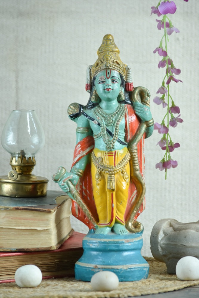 Ekaurr Cosmic Preserver Lord Vishnu hand-painted idol with conch and mace in bright green yellow and red with ornate crown, traditional devotional figurine for home altars and decor