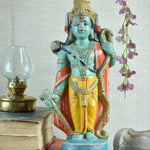 Ekaurr Cosmic Preserver Lord Vishnu hand-painted idol with conch and mace in bright green yellow and red with ornate crown, traditional devotional figurine for home altars and decor