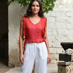 Ekaurr Crimson Reclaimed Flutter Top handcrafted upcycled fabric flutter-sleeve top in deep crimson with a light flowing hem, artisan slow fashion wearable for conscious women's styling
