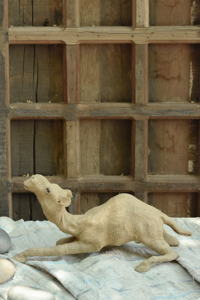 Ekaurr Desert Rest handcrafted jute camel sculpture in a resting pose, earthy natural fibre animal figurine for home decor shelves or nature-inspired styling