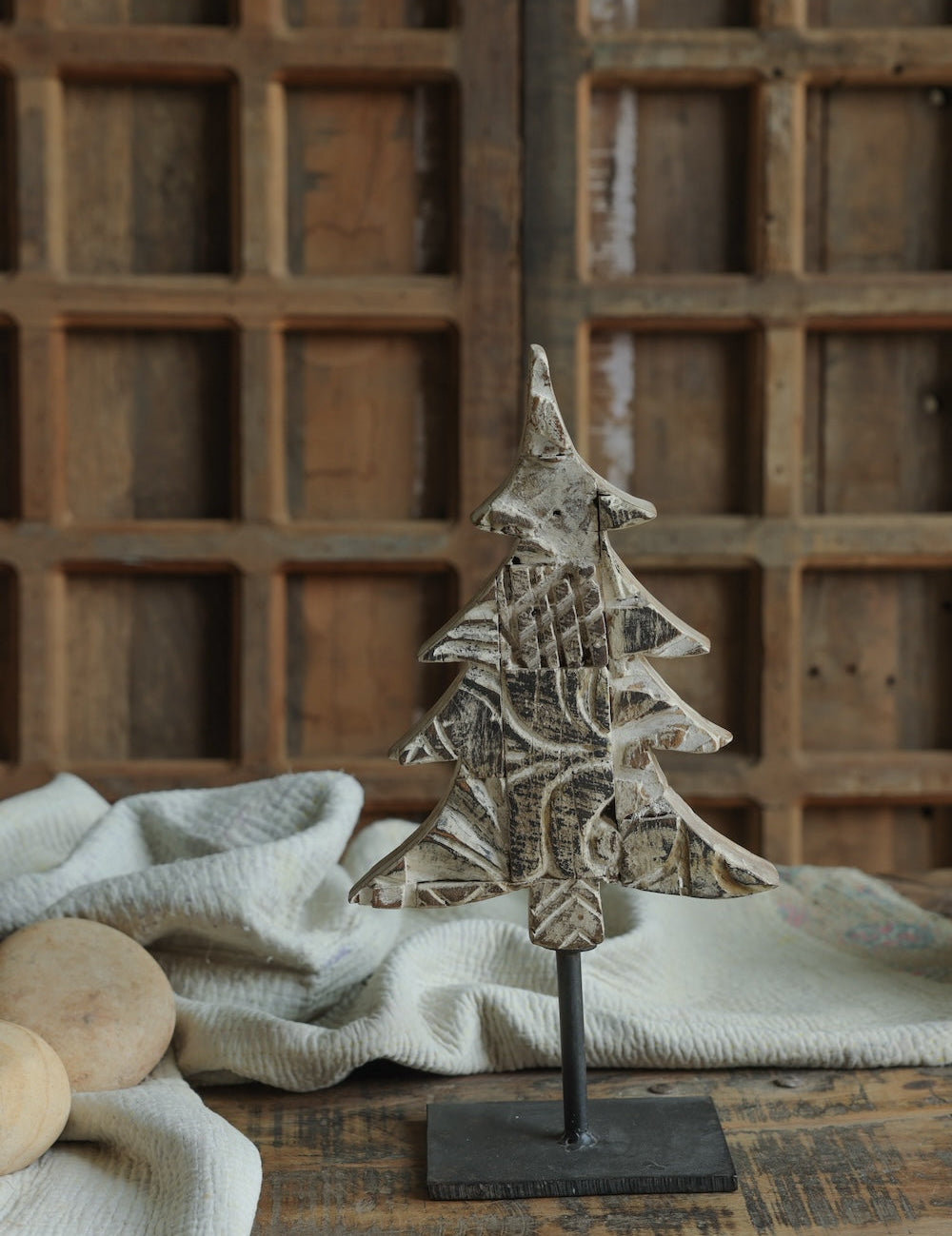 Ekaurr Distressed White Christmas Tree on Iron Base handcrafted paper mache tree in a whitewashed distressed finish mounted on an iron base, rustic festive home decor accent for shelves and mantels