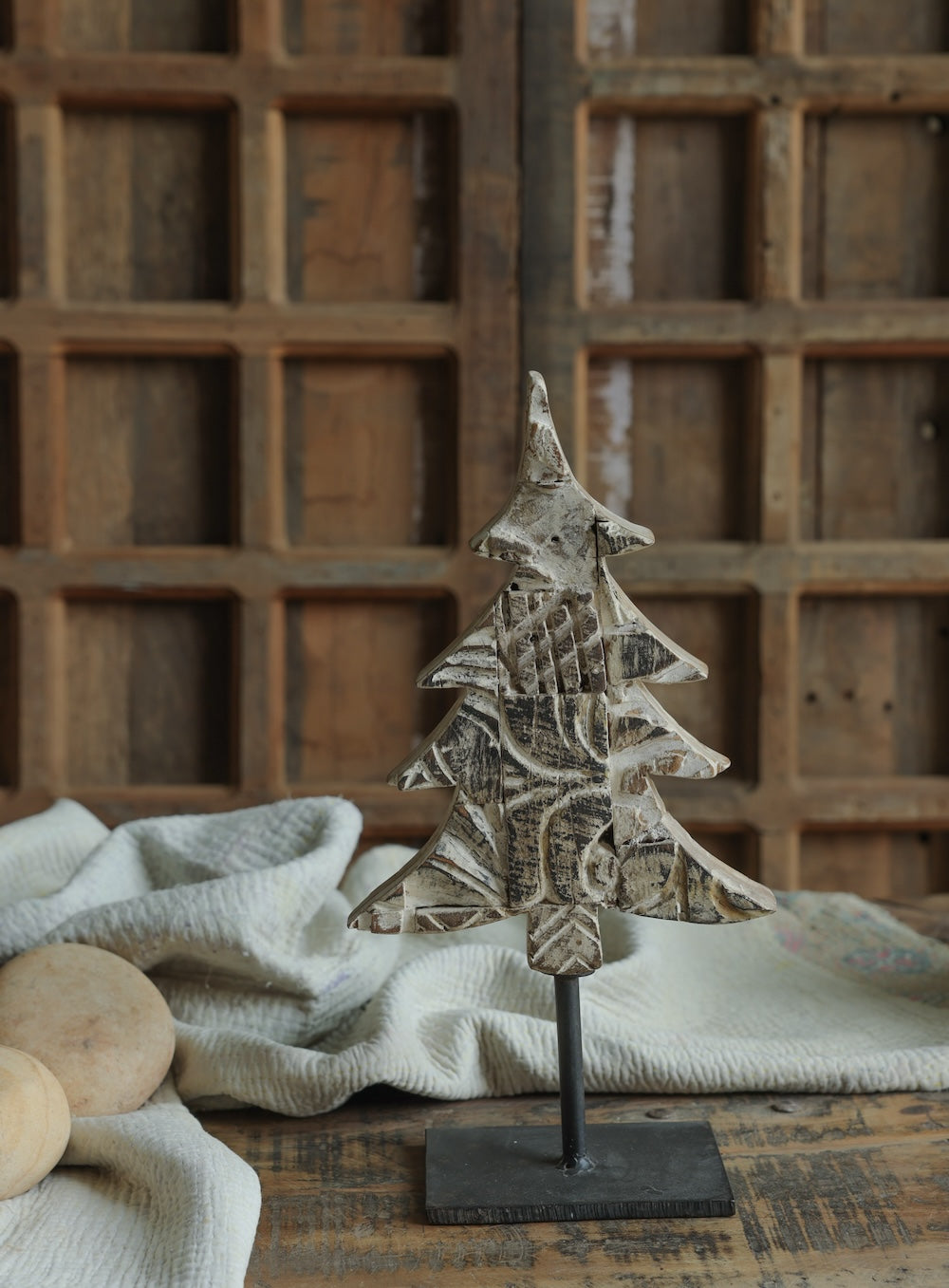Ekaurr Distressed White Christmas Tree on Iron Base handcrafted paper mache tree in a whitewashed distressed finish mounted on an iron base, rustic festive home decor accent for shelves and mantels
