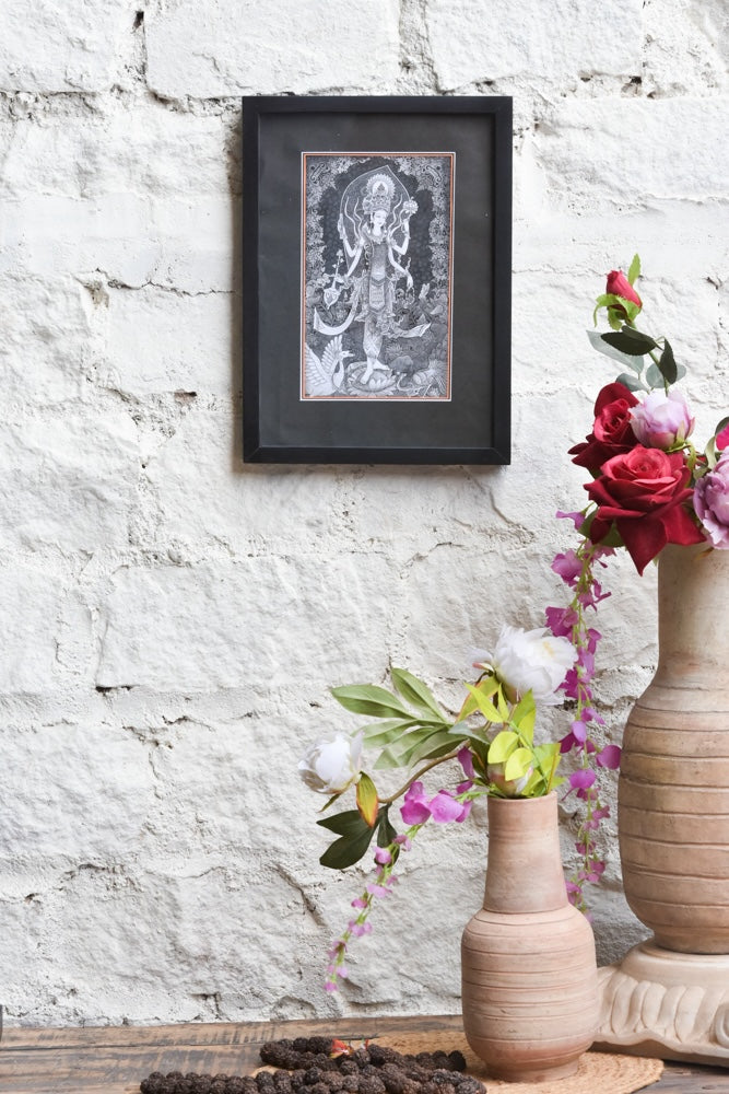 Ekaurr Divine Grace framed black-and-white wall art of Goddess Lakshmi in intricate traditional illustration style set against a matte black border, spiritual home decor for sacred and meditative spaces