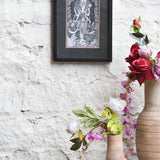 Ekaurr Divine Grace framed black-and-white wall art of Goddess Lakshmi in intricate traditional illustration style set against a matte black border, spiritual home decor for sacred and meditative spaces