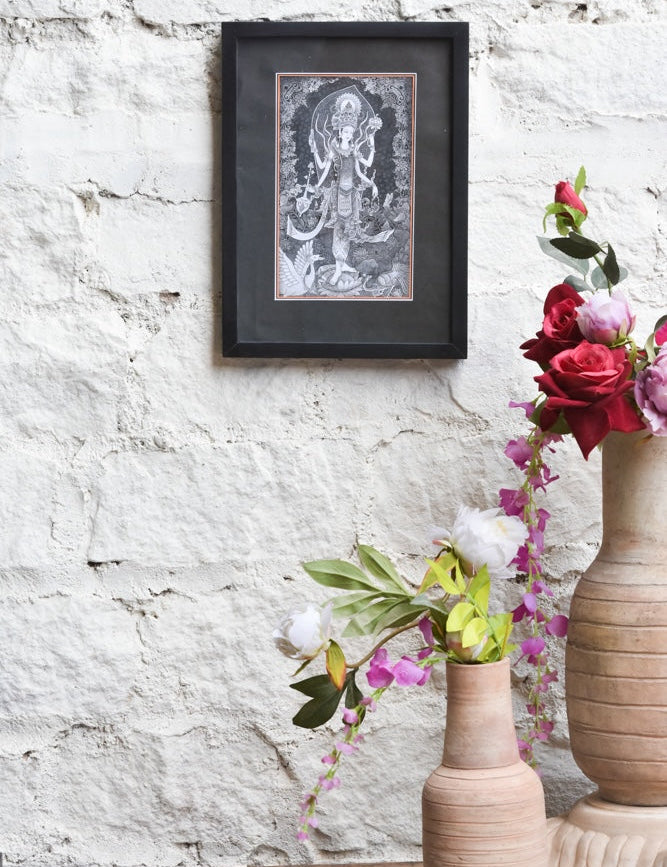 Ekaurr Divine Grace framed black-and-white wall art of Goddess Lakshmi in intricate traditional illustration style set against a matte black border, spiritual home decor for sacred and meditative spaces