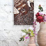 Ekaurr Divine Slumber hand-carved wooden Buddha wall panel depicting a reclining Buddha in a serene sleeping pose with intricate carved surface detailing, artisan spiritual home decor for meditation corners and statement walls