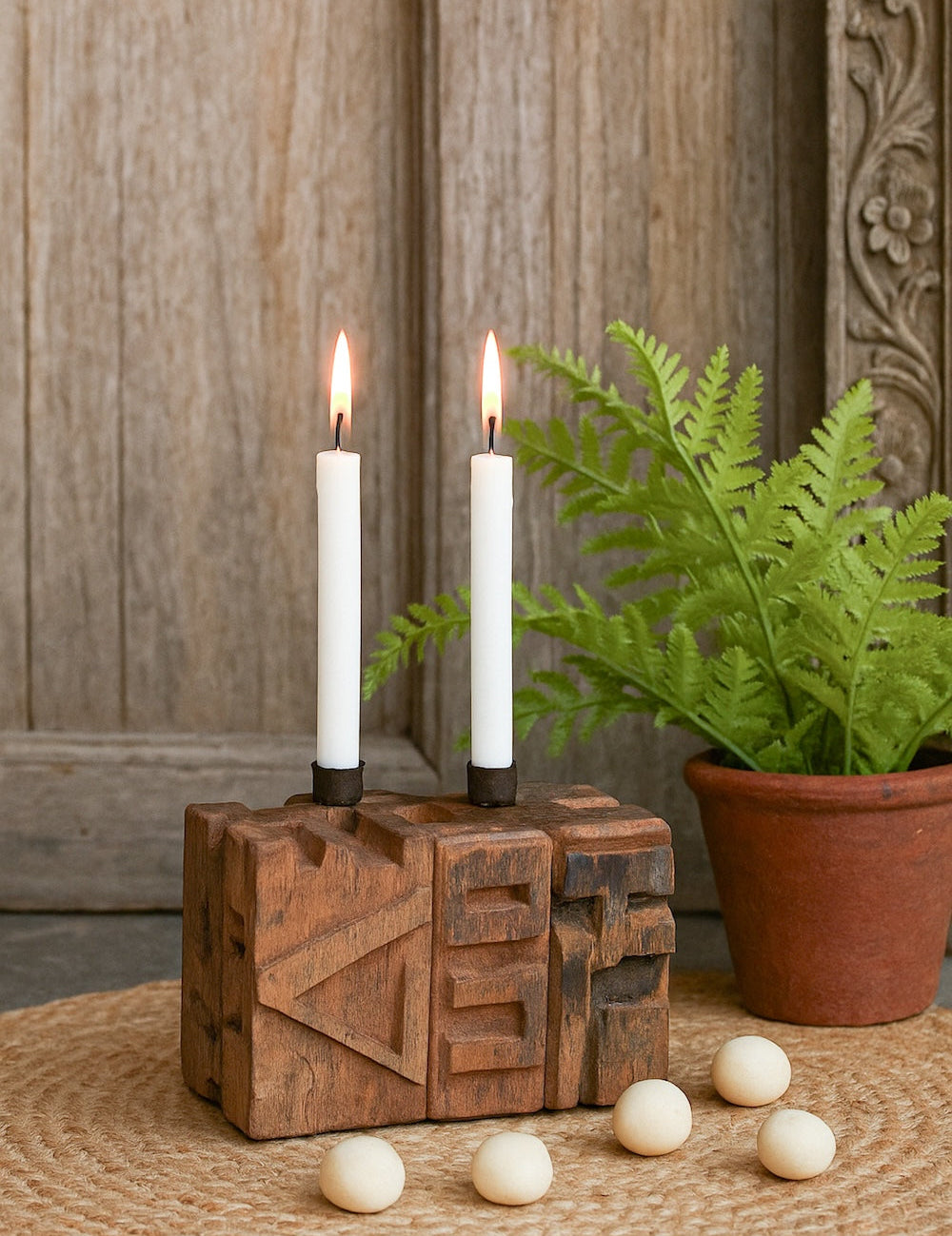 Ekaurr Emblem Candle Holder with 2 candle wells crafted from a repurposed vintage brick mould emblem with hand-carved patterns and aged texture, one-of-a-kind artisan candle holder for rustic home decor