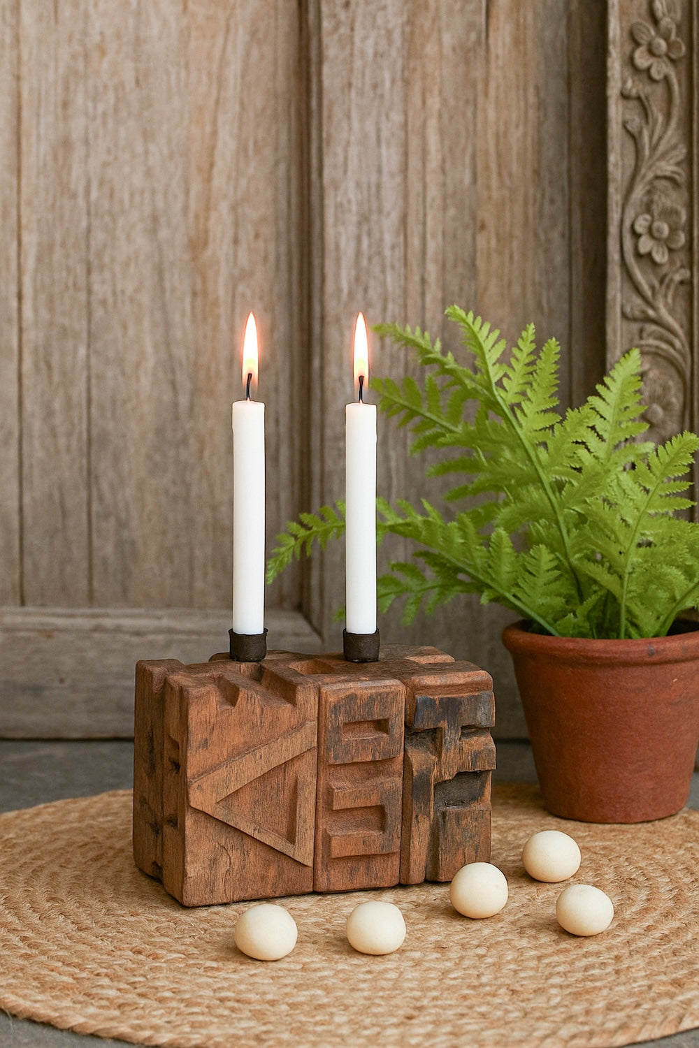 Ekaurr Emblem Candle Holder with 2 candle wells crafted from a repurposed vintage brick mould emblem with hand-carved patterns and aged texture, one-of-a-kind artisan candle holder for rustic home decor
