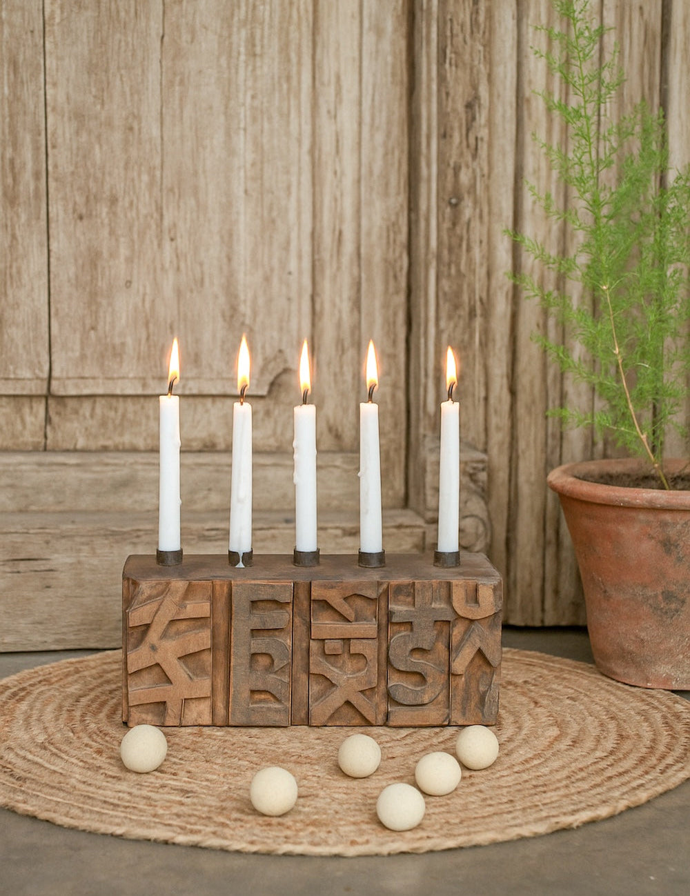 Ekaurr Emblem Candle Holder with 5 candle wells crafted from a repurposed vintage brick mould emblem with hand-carved pattern surface, statement artisan candle holder for mantel dining and rustic home styling