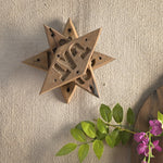 Ekaurr Emblem Star Wall Art vintage brick mould emblem repurposed as a decorative star-motif wall art piece, artisan found object wall accent for rustic and eclectic home interiors