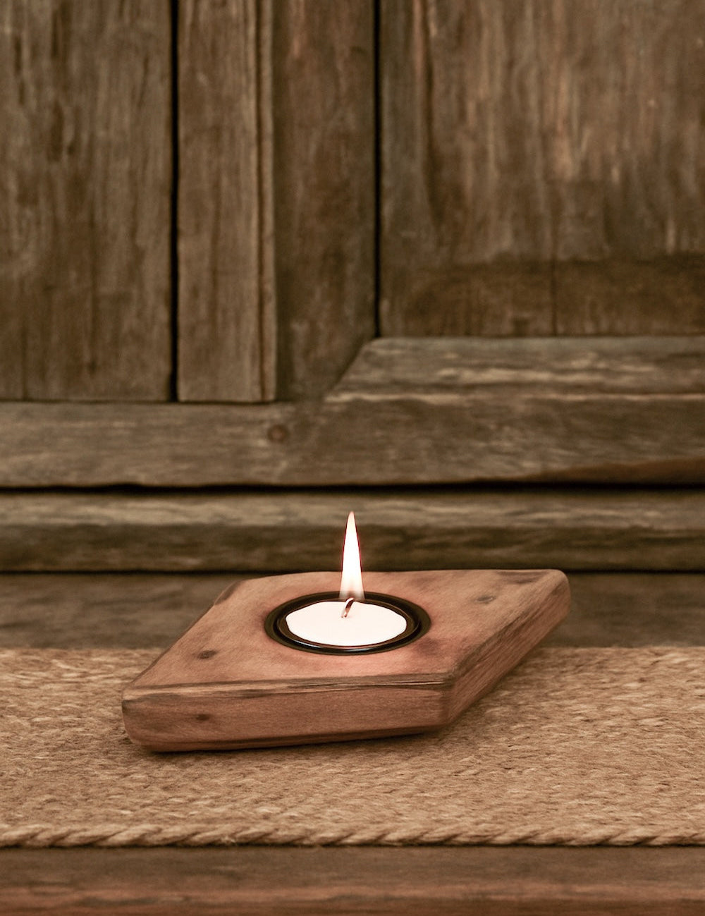 Ekaurr Emblem Tea Light Holder repurposed vintage brick mould emblem with hand-carved relief surface and single tea light well, artisan found object candle holder for shelves and home decor