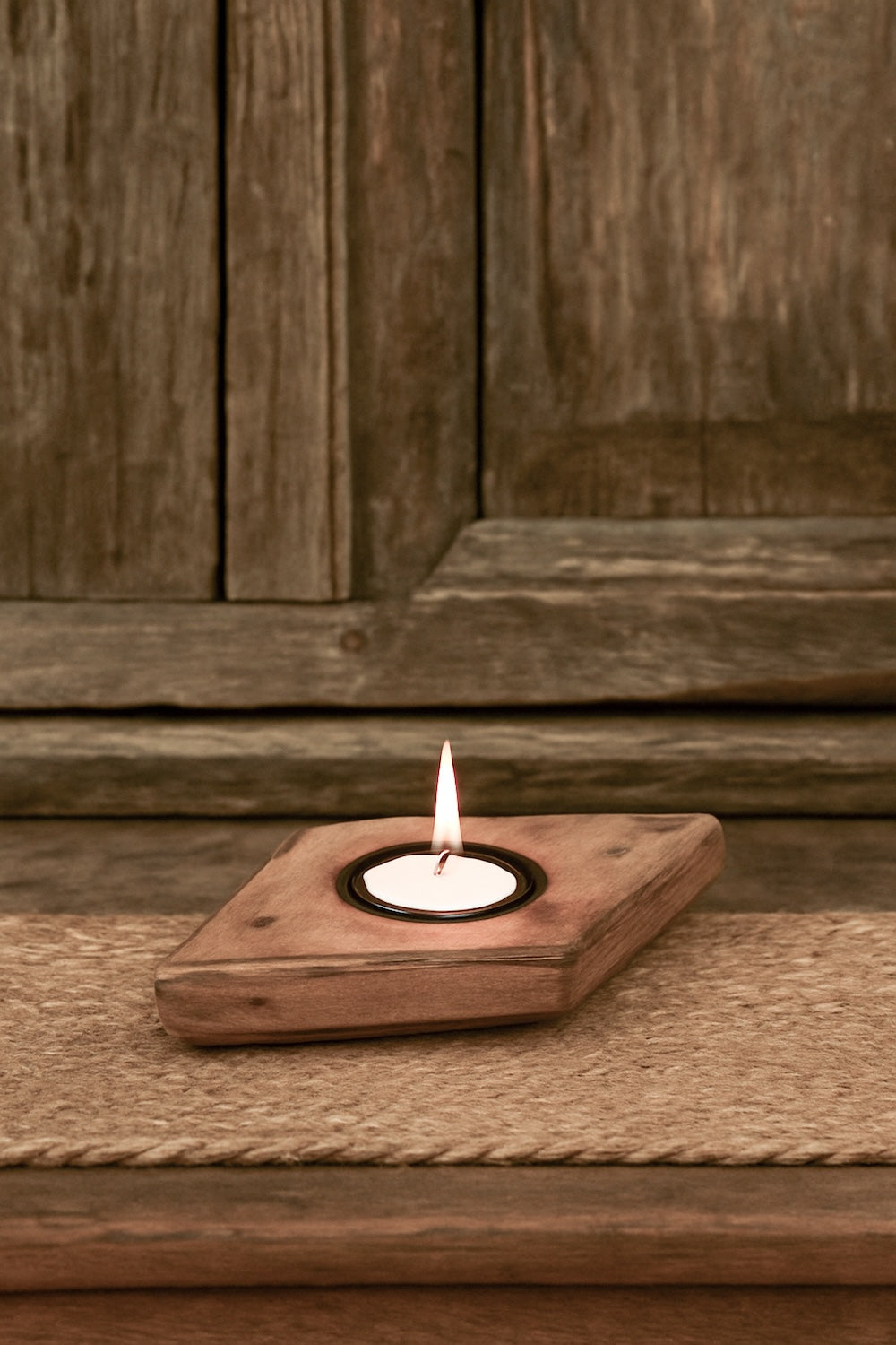 Ekaurr Emblem Tea Light Holder repurposed vintage brick mould emblem with hand-carved relief surface and single tea light well, artisan found object candle holder for shelves and home decor