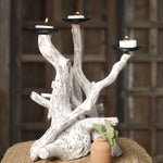 Ekaurr Eternal Tide Candle Tree – sculptural driftwood centerpiece holding multiple candles, warm ambient light