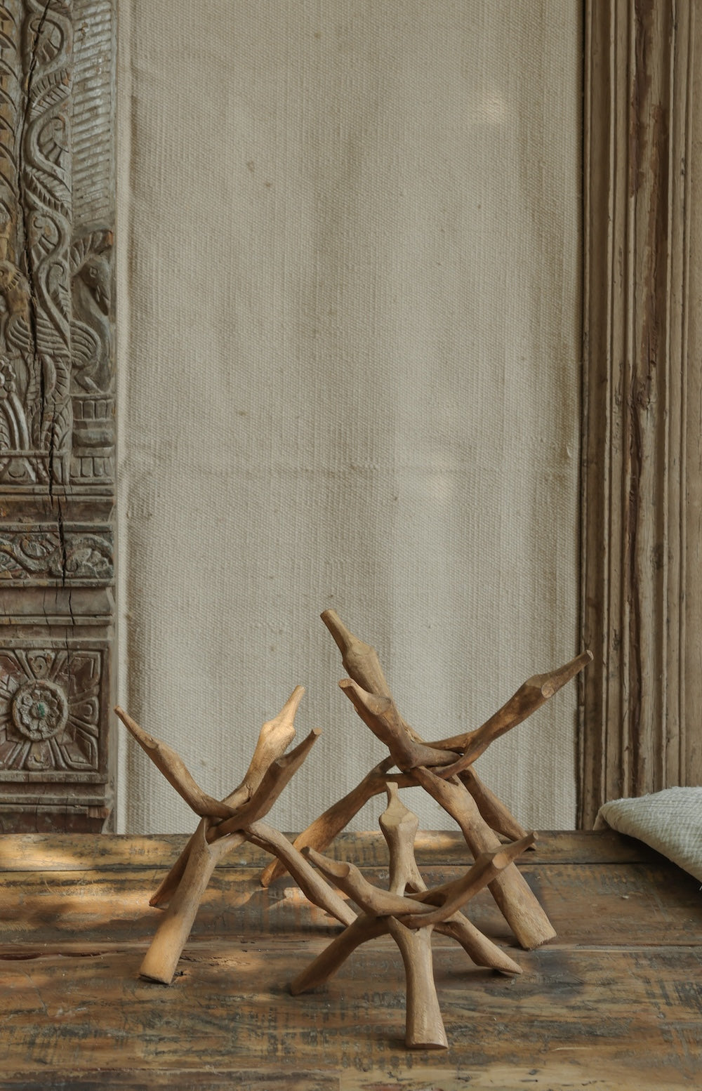 Ekaurr Foldable Wooden Stands shown in open display position showing the collapsible joint and natural wood surface