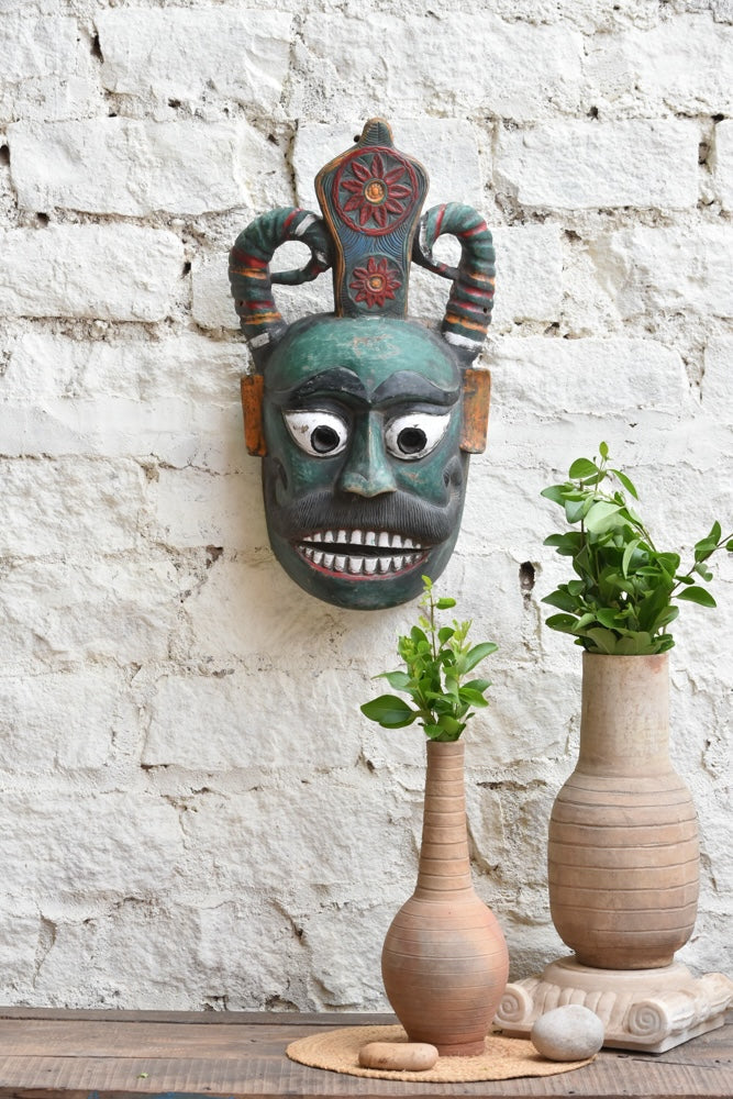 Ekaurr Forest Guardian vintage hand-carved wooden wall mask with bold horns, expressive eyes and intricate crown, one-of-a-kind protective tribal home décor