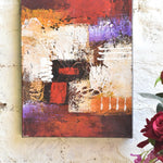 Ekaurr Fragments of Flame original abstract painting with layered textures in crimson ochre ivory and violet tones anchored by bold red blocks, handcrafted expressive canvas art for living rooms and contemporary home interiors