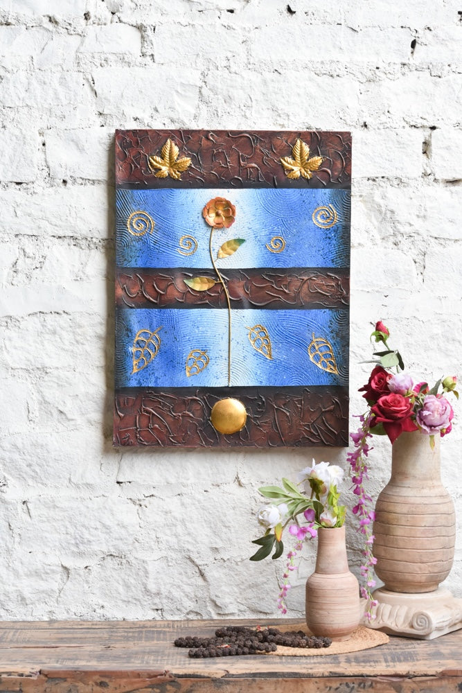 Ekaurr Golden Bloom on Blue mixed-media wall art of a radiant flower rising against a vivid blue ground with embossed swirling motifs and metallic gold leaf detailing at 24x32 inches, handcrafted home decor for entryways and living rooms