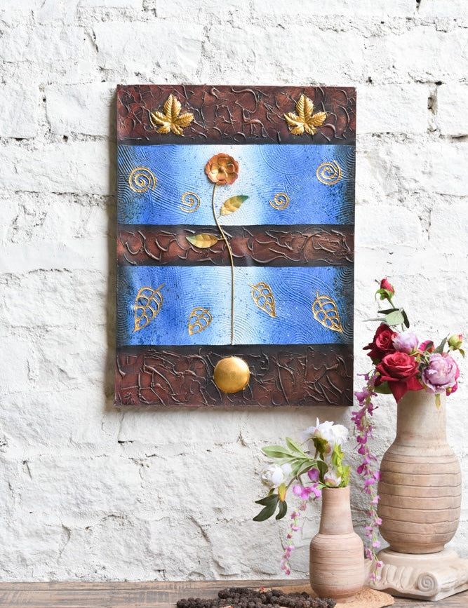Ekaurr Golden Bloom on Blue mixed-media wall art of a radiant flower rising against a vivid blue ground with embossed swirling motifs and metallic gold leaf detailing at 24x32 inches, handcrafted home decor for entryways and living rooms