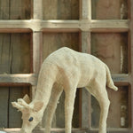 Ekaurr Grazing Giraffe handcrafted jute sculpture of a tall giraffe with neck lowered in a grazing pose, earthy natural fibre wildlife figurine for home decor consoles and shelves