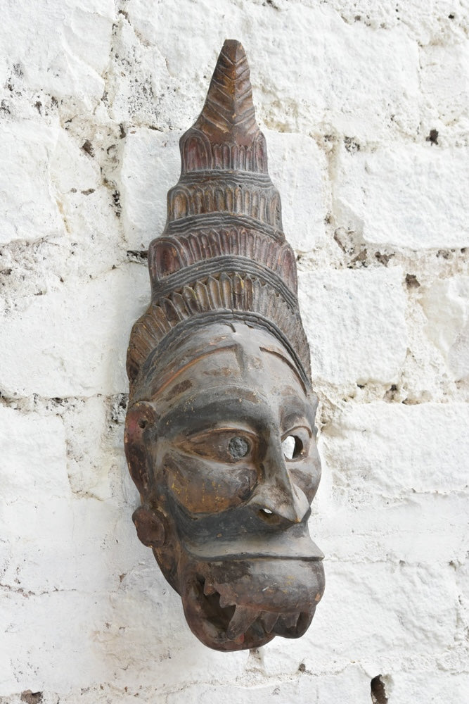 Ekaurr Guardian Spirit Mask angled view revealing three-dimensional carving depth and weathered reclaimed wood surface