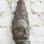 Ekaurr Guardian Spirit Mask angled view revealing three-dimensional carving depth and weathered reclaimed wood surface