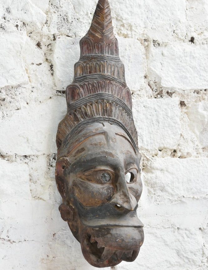 Ekaurr Guardian Spirit Mask angled view revealing three-dimensional carving depth and weathered reclaimed wood surface