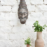 Ekaurr Guardian Spirit hand-carved wooden wall mask with bold commanding features and headdress detailing, vintage one-of-a-kind tribal protective sculpture