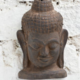 Ekaurr Hand Carved Buddha Wall Sculpture close-up showing soft carved contours, meditative smile and natural aged wood finish