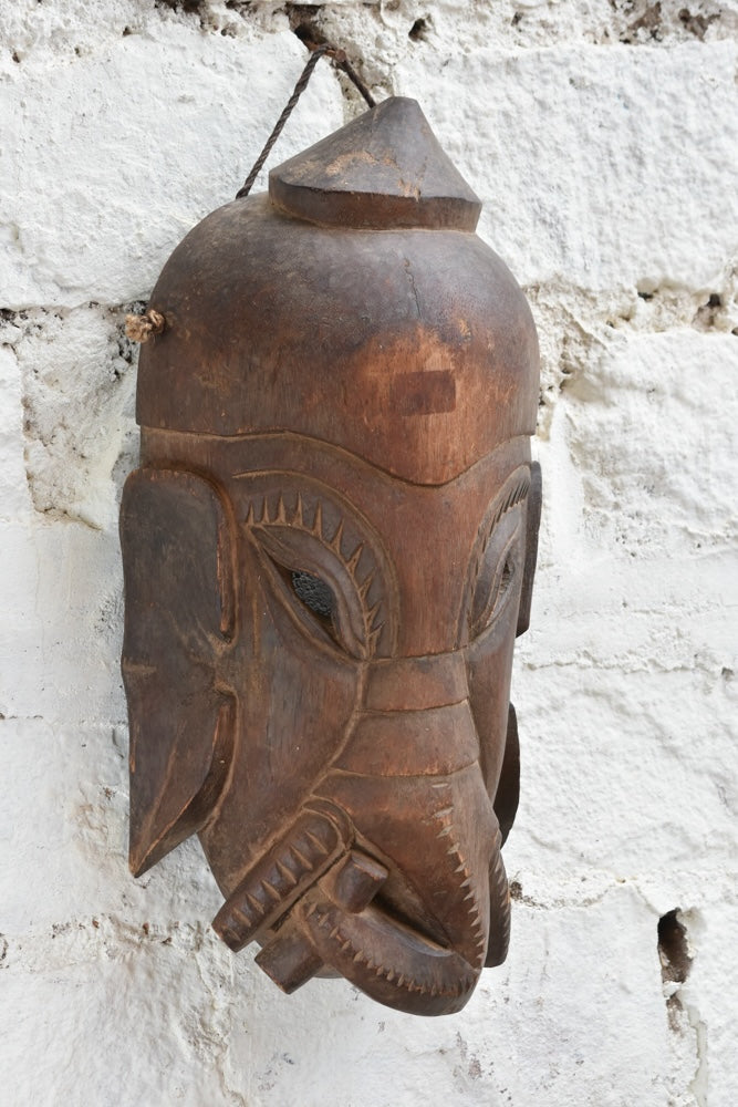 Ekaurr Hand Carved Elephant Wisdom Mask detail view showing carved trunk, earthy texture and rich hand-done finish in reclaimed wood