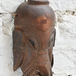 Ekaurr Hand Carved Elephant Wisdom Mask detail view showing carved trunk, earthy texture and rich hand-done finish in reclaimed wood