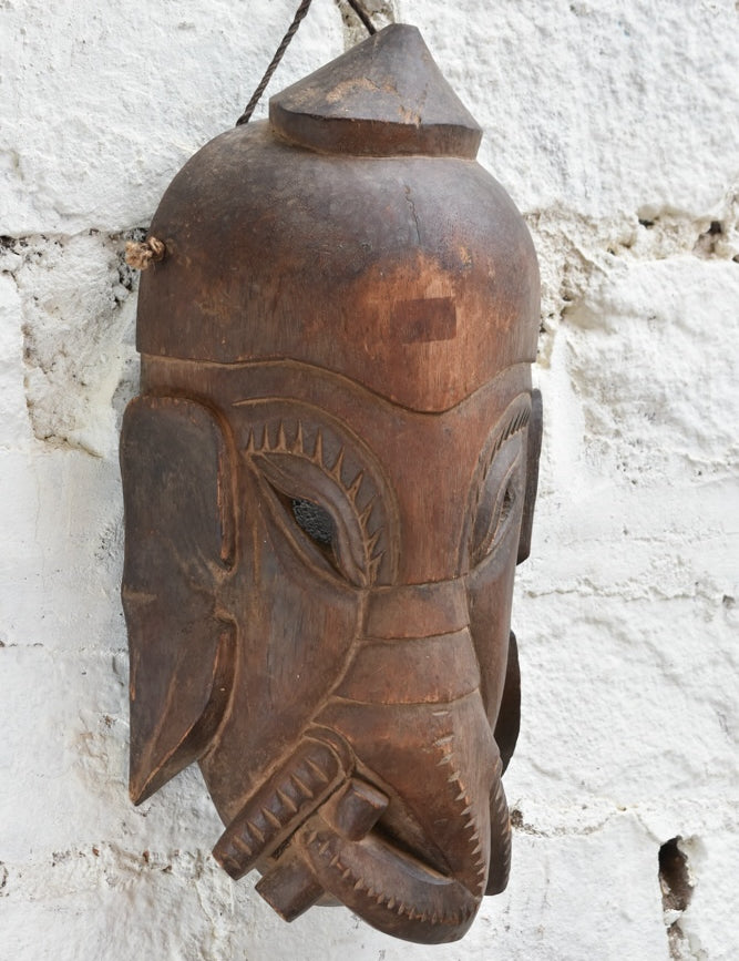 Ekaurr Hand Carved Elephant Wisdom Mask detail view showing carved trunk, earthy texture and rich hand-done finish in reclaimed wood