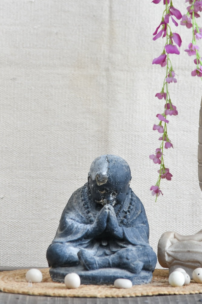 Ekaurr Humble Devotion Buddha handcrafted ceramic figurine in a reverent bowed posture, artisan spiritual sculpture for home altars and mindful living spaces